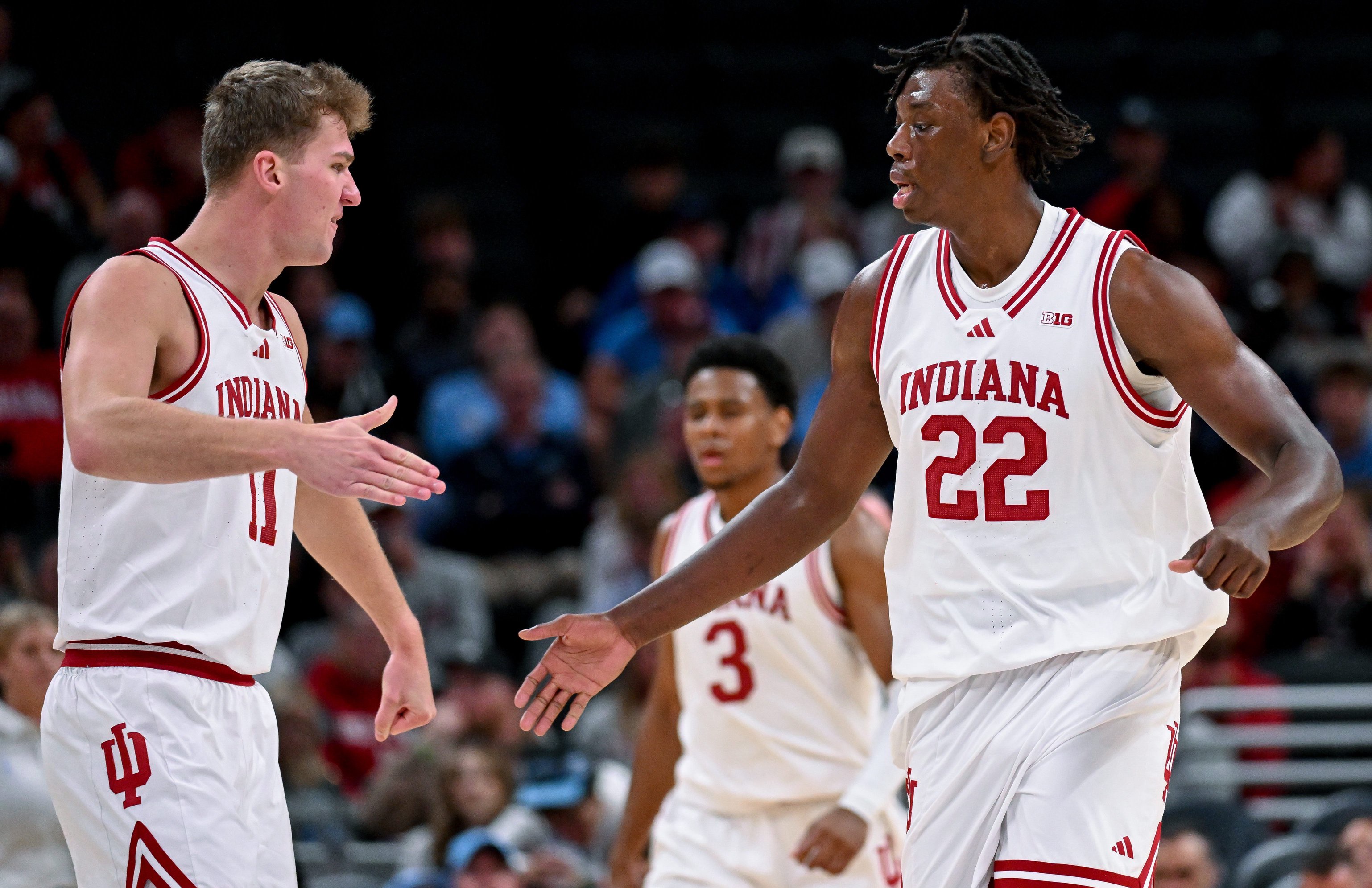 Oct 18, 2026; Indianapolis, IN, USA; Indiana Hoosiers forward Trent Sisley (11) high-fives Indiana Hoosiers forward Aiden Sherrell (22) against the North Carolina Tar Heels during the first half at Gainbridge Fieldhouse. Mandatory Credit: Robert Goddin-Imagn Images