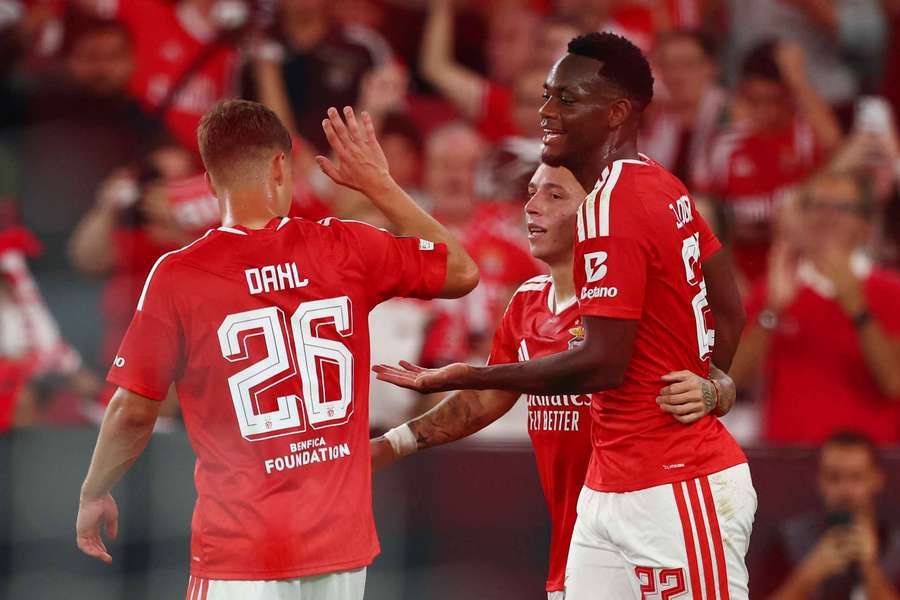 Benfica's Jhon Duran celebrates scoring their third goal with Samuel Dahl and Gianluca Prestianni