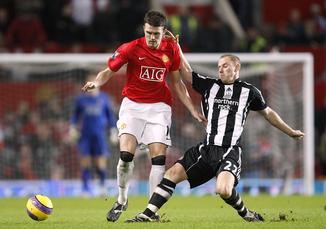 Nicky Butt tackles Michael Carrick 