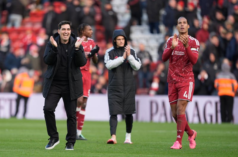 Liverpool manager Andoni Iraola and Virgil van Dijk celebrate at full-time at Anfield. Photograph: Peter Byrne/PA