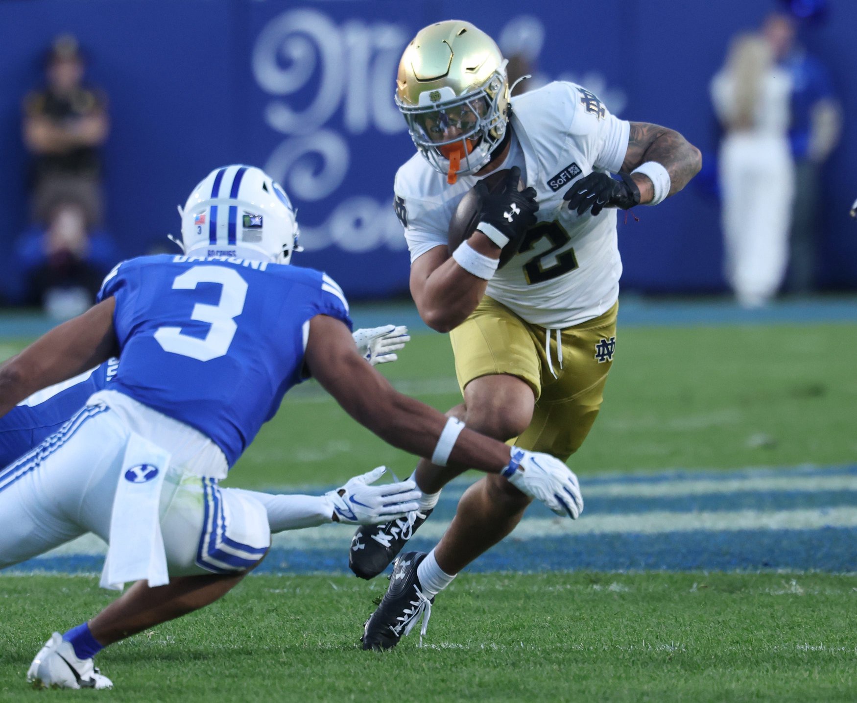 Oct 17, 2026; Provo, Utah, USA; Notre Dame Fighting Irish running back Nolan James Jr. (2) runs the ball against Brigham Young Cougars safety Raider Damuni (3) during the first half during the first half at LaVell Edwards Stadium. Mandatory Credit: Rob Gray-Imagn Images