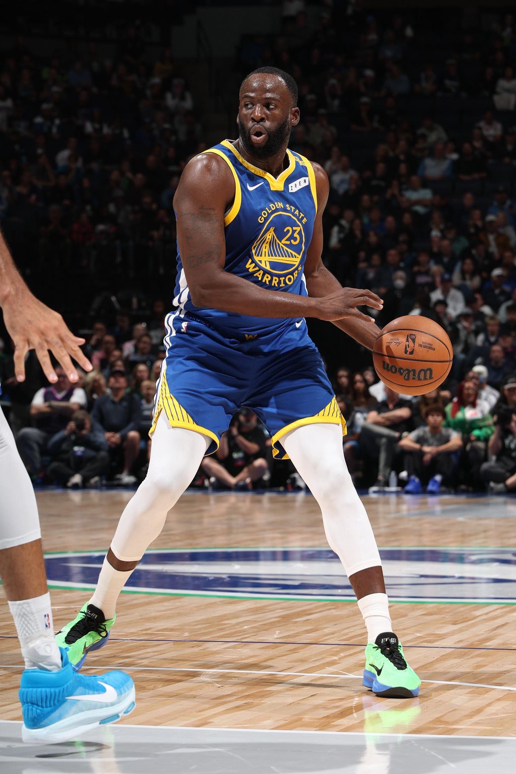 Draymond Green of the Golden State Warriors handles the ball during a game against the Minnesota Timberwolves.