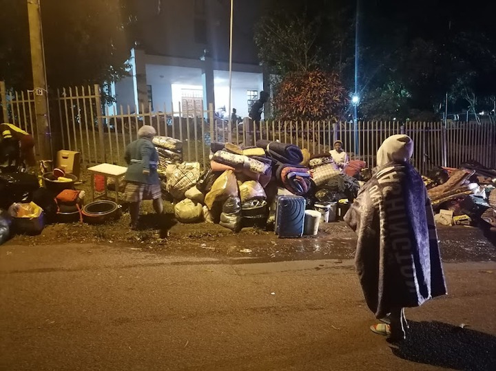 Evictees and their belongings outside the Yellowwood Park civil hall in Durban on Monday night.