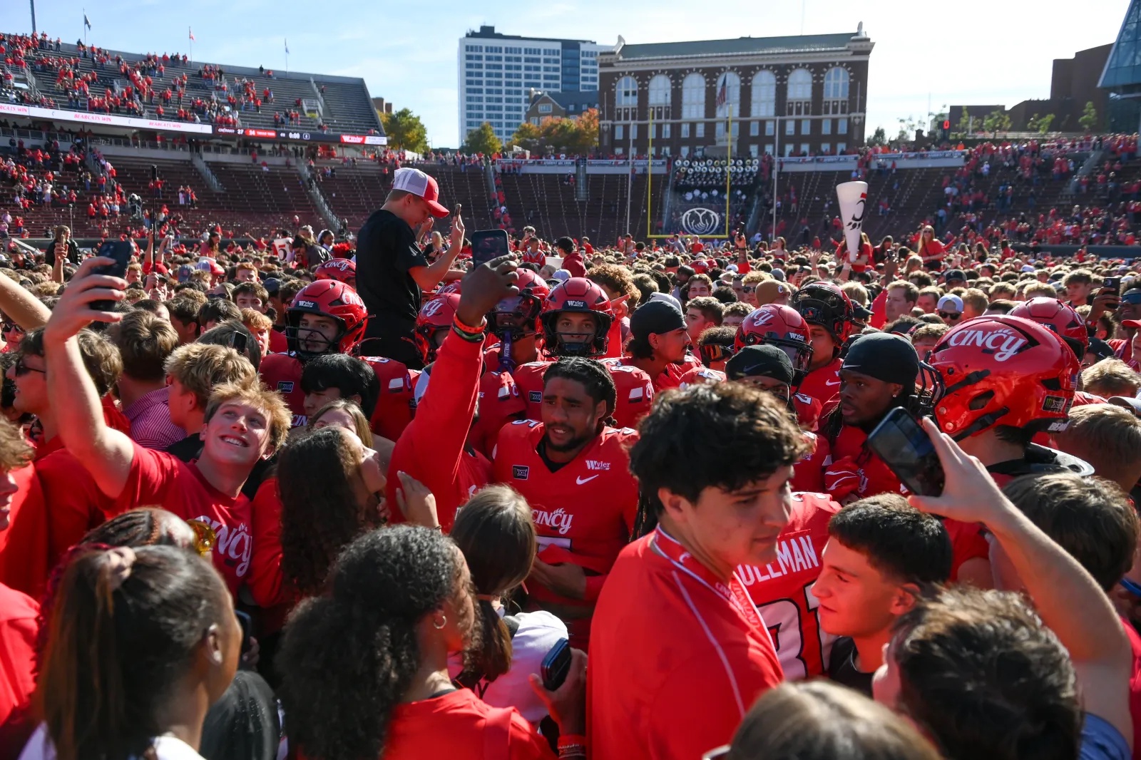 Bearcats’ fans rushing field