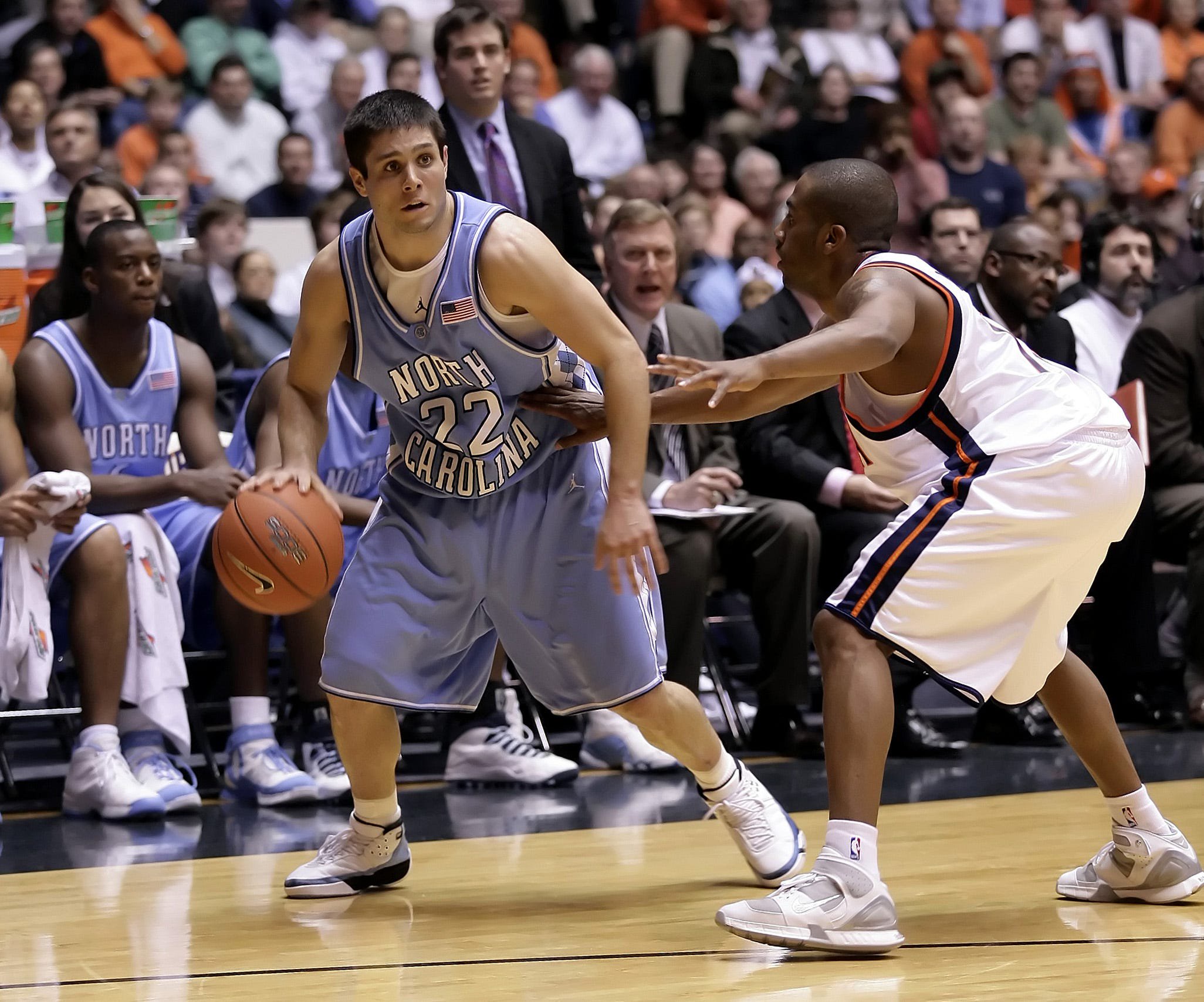 Jan 19, 2006; Charlottesville, VA, USA; North Carolina Tar Heels guard Wes Miller (22) looks to drive to the basket as Virginia Cavaliers guard J.R. Reynolds (2) tries to hold him back during 2nd half action at University Hall. Mandatory Credit: Geoff Burke-USA TODAY Sports Copyright © 2006 Geoff Burke
