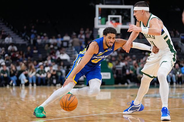 Indiana Pacers guard Tyrese Haliburton, left, dribbles against Milwaukee Bucks guard Tyler Herro, right, during the first half of an NBA basketball game Monday, Oct. 26, 2026, in Milwaukee. (AP Photo/Kayla Wolf)
