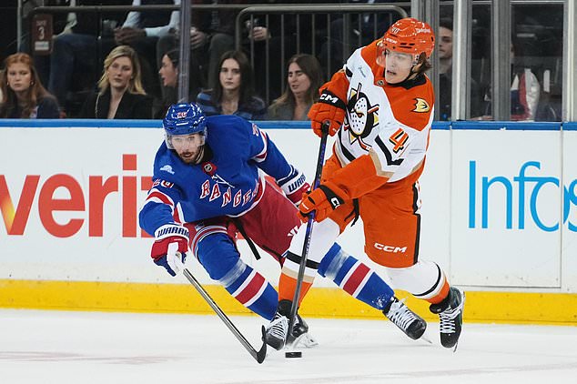 New York Rangers' Marcus Pettersson (26) defends Anaheim Ducks' Nikita Klepov (40) during the first period of an NHL hockey game Monday, Oct. 19, 2026, in New York. (AP Photo/Frank Franklin II)