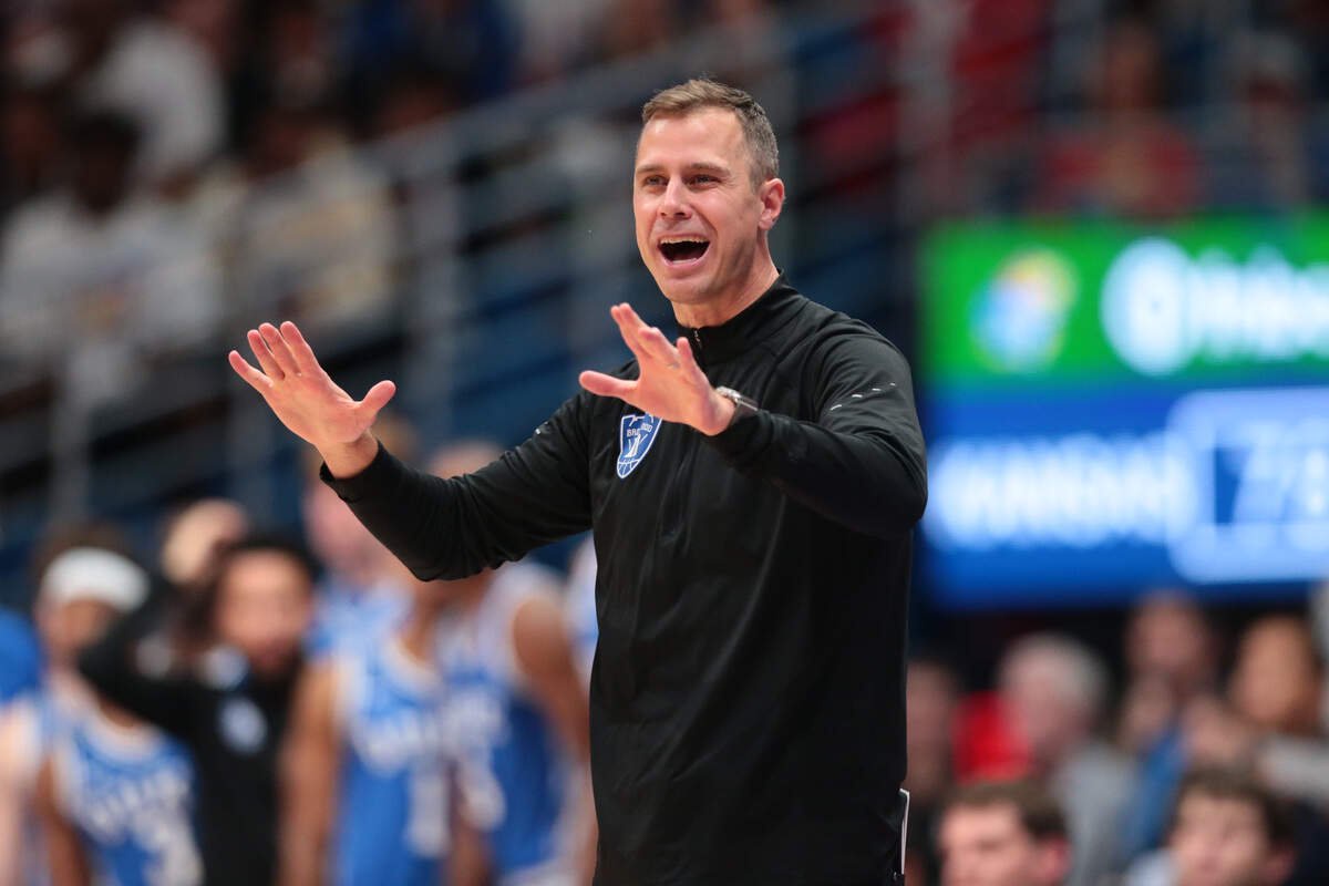 Duke Blue Devils head coach Jon Scheyer makes adjustments against Kansas Jayhawks during the exhibition game inside Allen Fieldhouse in Lawrence, Kansas on Oct. 25, 2026.