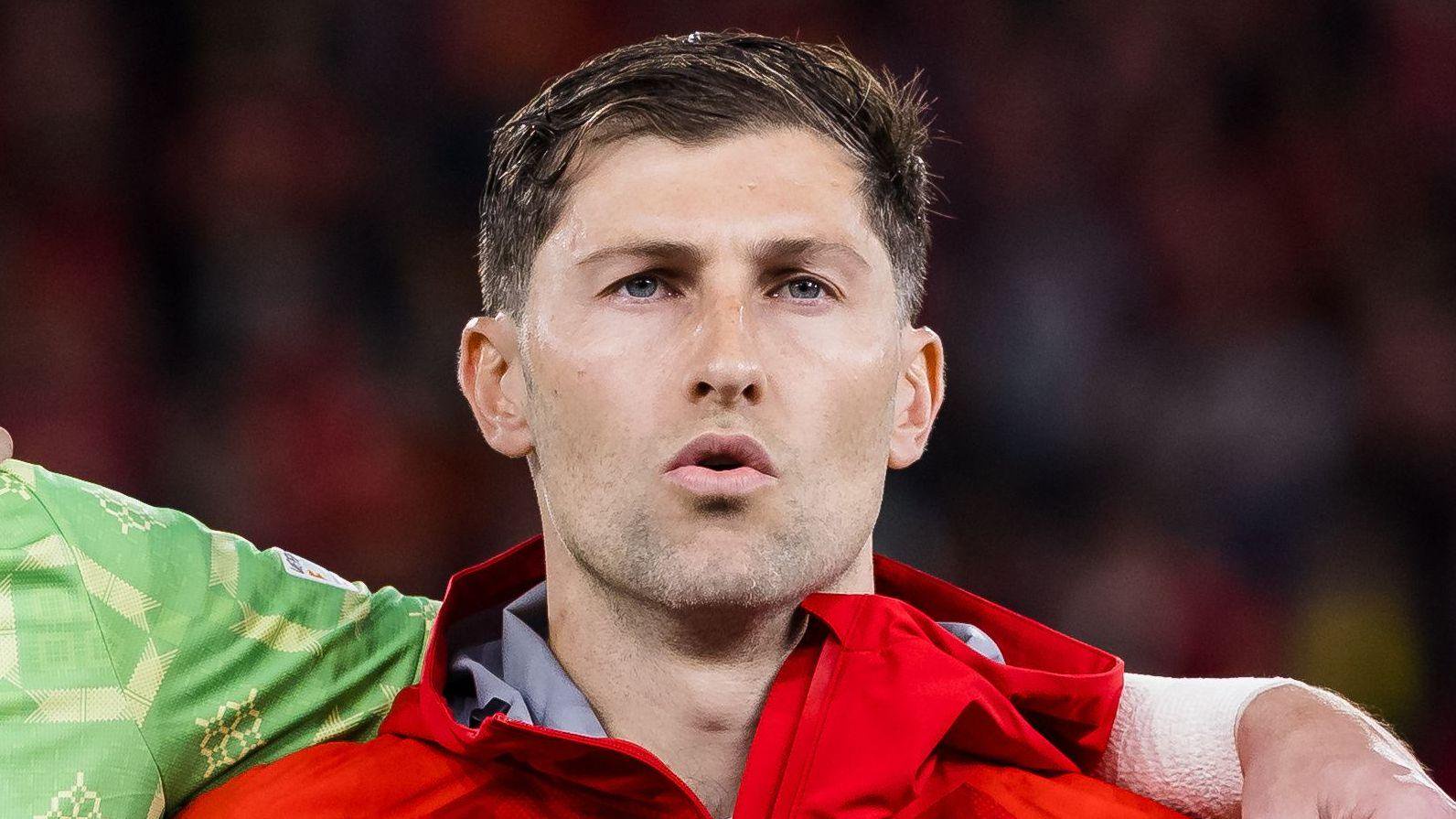 Ben Davies pictured singing the Welsh national anthem ahead of their defeat to Denmark in early October.