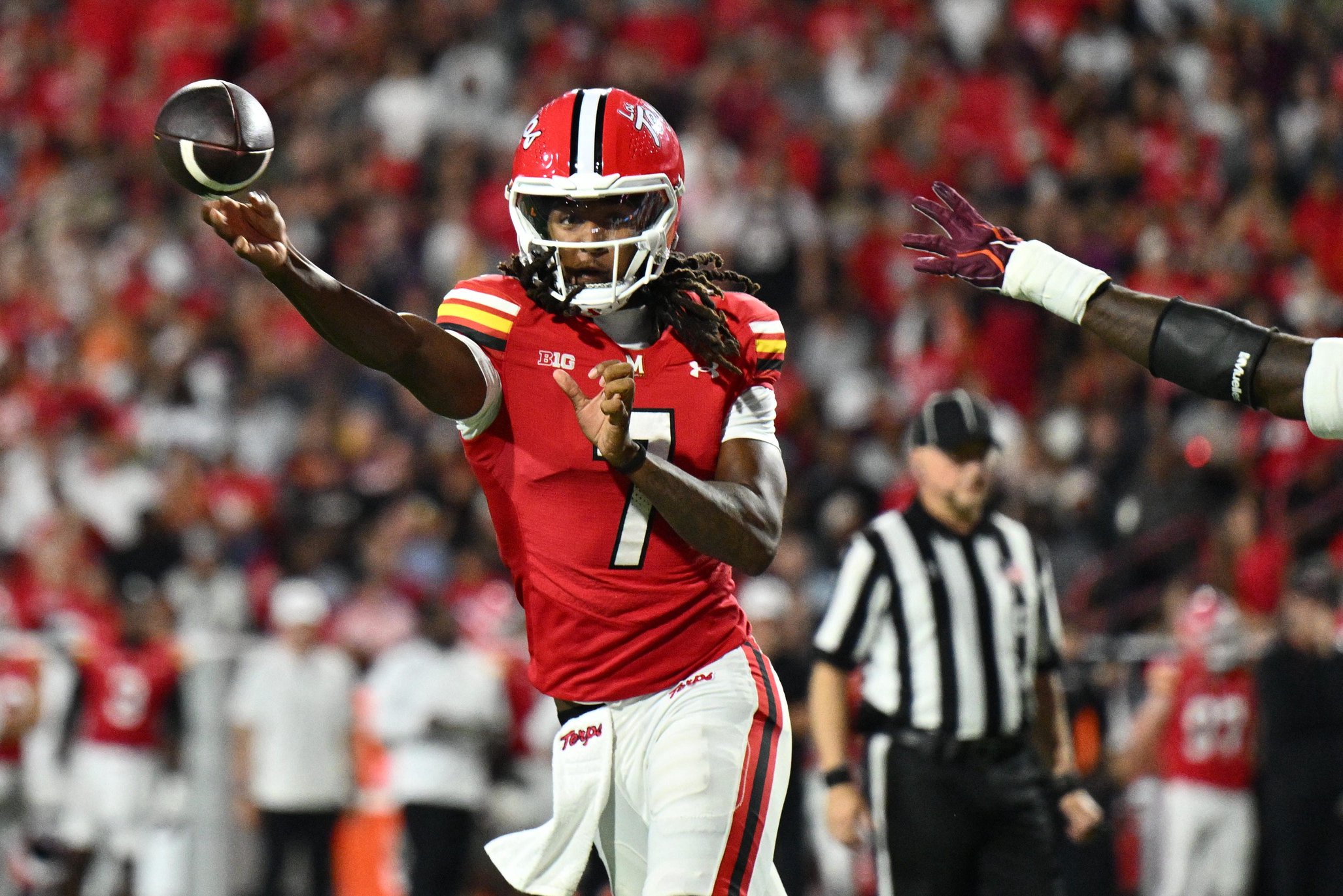 Sep 19, 2026; College Park, Maryland, USA;  Maryland Terrapins quarterback Malik Washington (7) passes in the first half against the Virginia Tech Hokies at SECU Stadium. Mandatory Credit: Jamie Sabau-Imagn Images