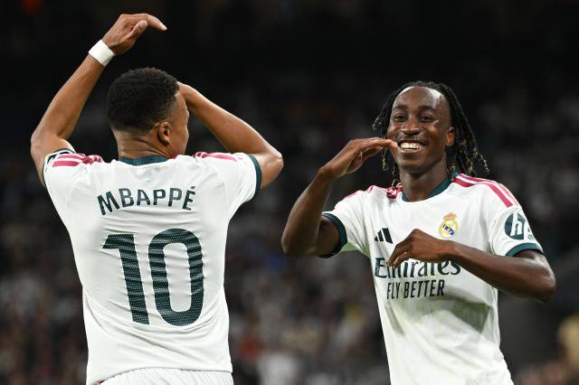 Kylian Mbappé and Yan Diomande celebrating.