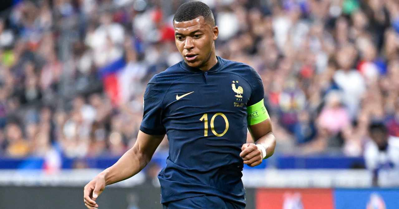 La Liga team Real Madrid Football Club footballer Kylian Mbappe playing for the France national team in a blue shirt while wearing a green captain armband on his left arm with his number 10 and the Nike logo in yellow on his chest