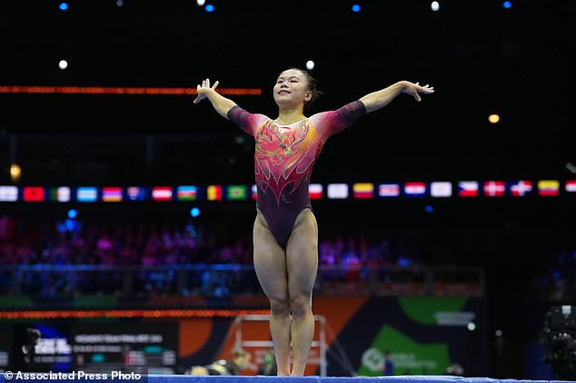 Zhang Qingying, of China, gestures after competing in the beam during the women's team final at the Artistic Gymnastics World Championships in Rotterdam, the Netherlands, Wednesday, Oct. 21, 2026. (AP Photo/Patrick Post)