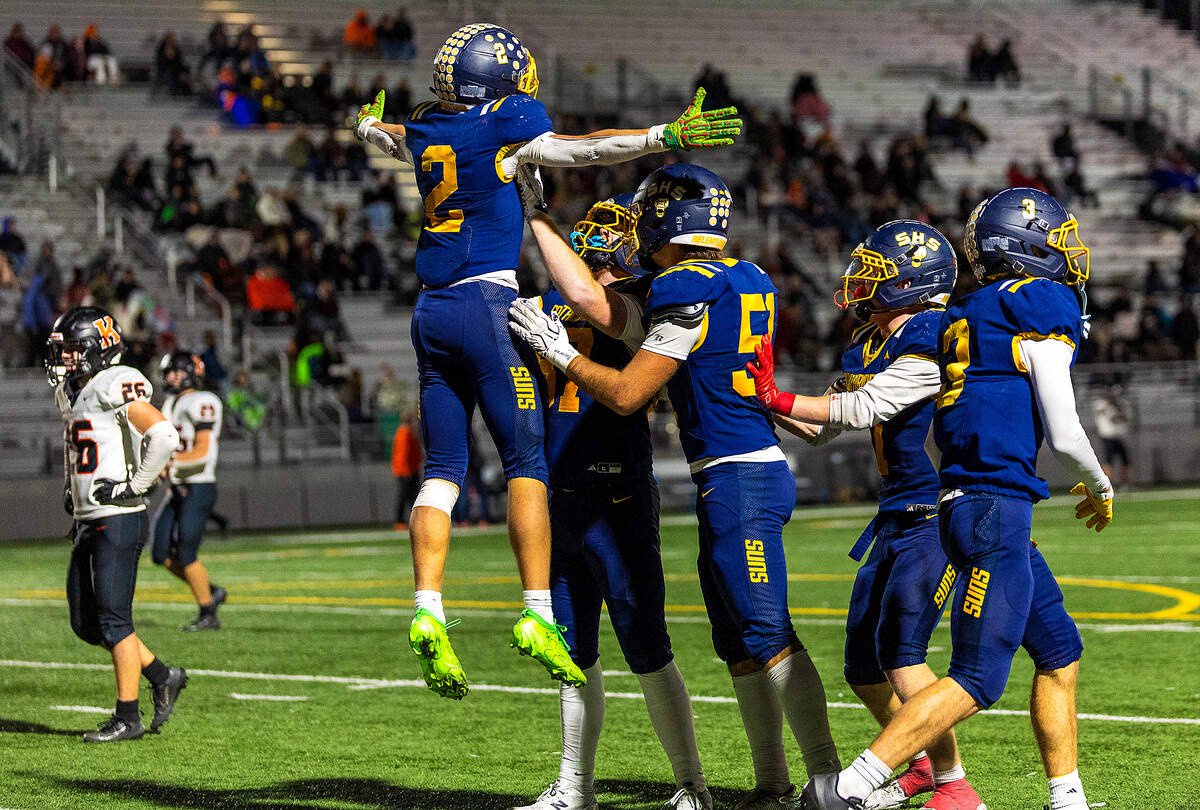 Southridge's Tayton Jackman (2) leaps into the air as teammate Levi Pettijohn (87) lifts him in celebration following Jackman's 88-yard touchdown run against Kennewick in the fourth quarter Thursday, Oct. 29, 2026, at Neil F. Lampson Stadium in Kennewick.