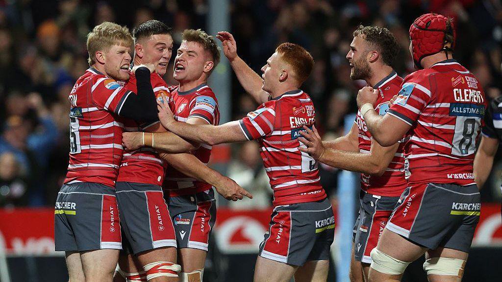 Gloucester celebrate scoring a try against Bath