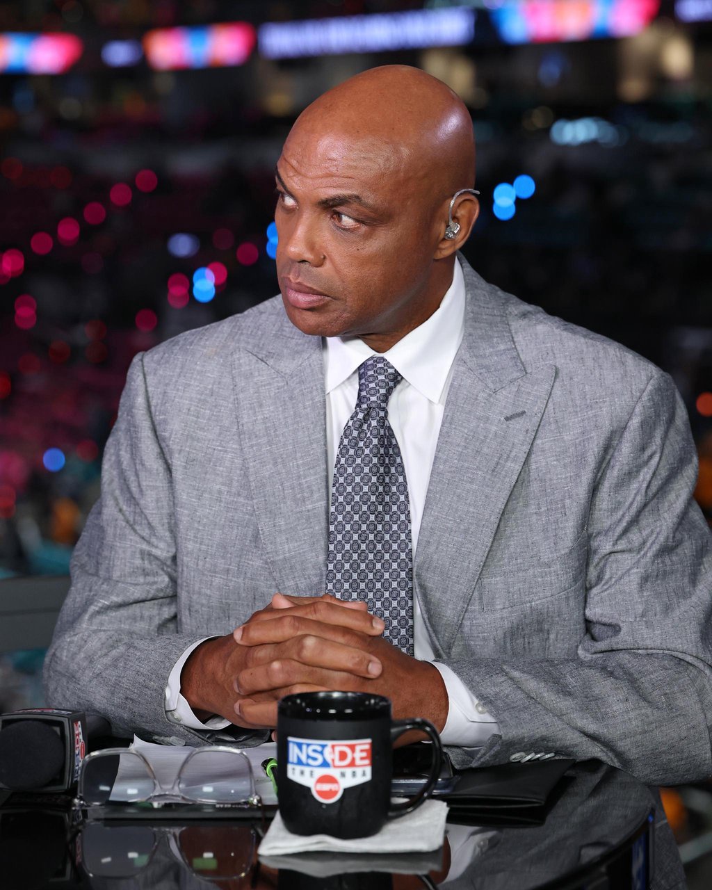 Charles Barkley sitting at a desk with an Inside the NBA mug during the 2026 NBA Finals.