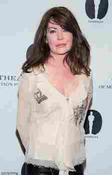 Lara Flynn Boyle revealed she only found out she was cut from one of Robin Williams' highest-grossing films after watching the movie with her mother, Sally; pictured seen in 2013