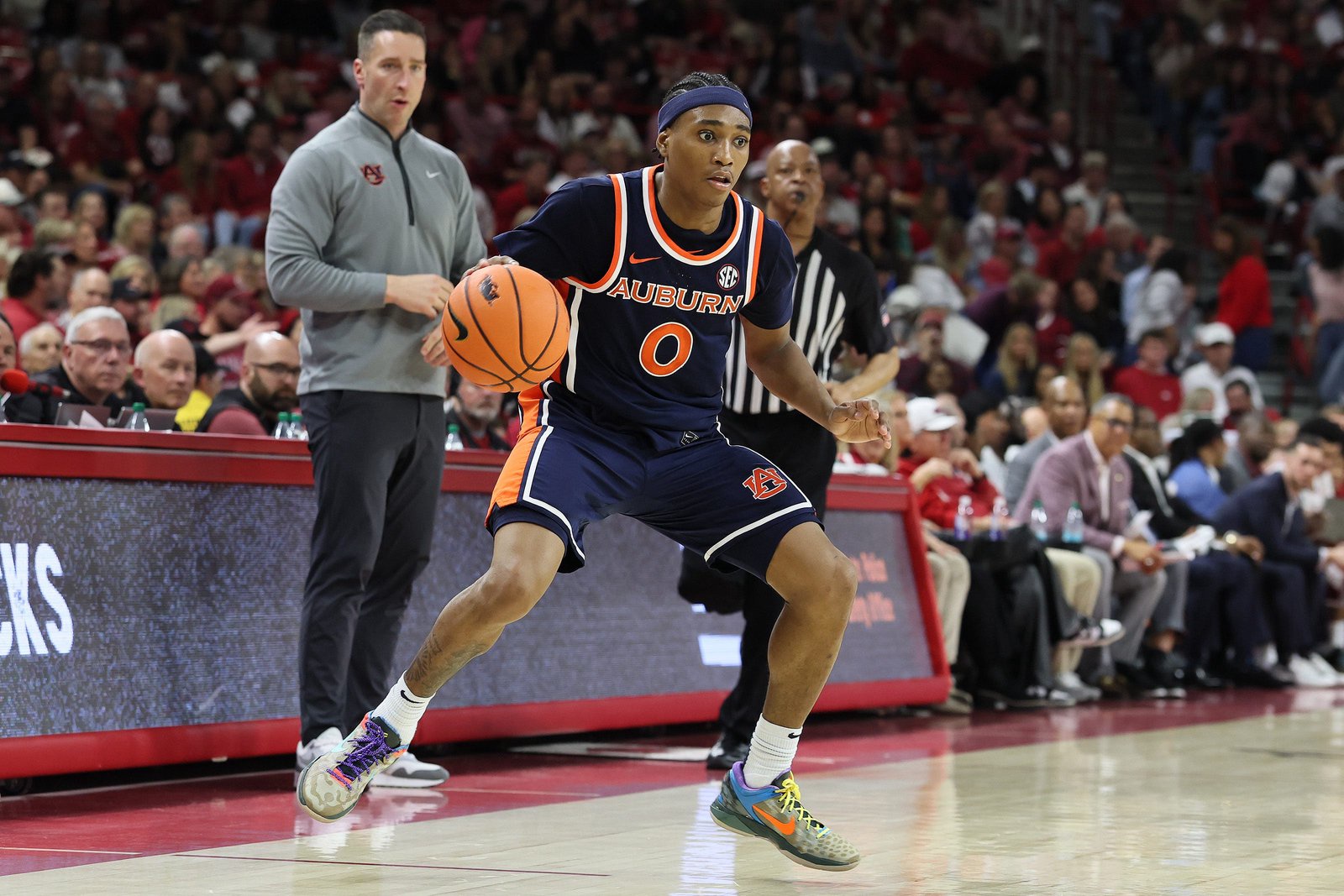Feb 14, 2026; Fayetteville, Arkansas, USA; Auburn Tigers guard Tahaad Pettiford (0) dribbles during the second half against the Arkansas Razorbacks at Bud Walton Arena. Mandatory Credit: Nelson Chenault-Imagn Images