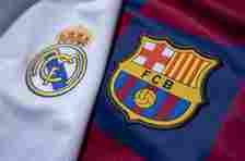 The FC Barcelona and Real Madrid club crests on the first team home shirts on July 22, 2020 in Manchester, United Kingdom.