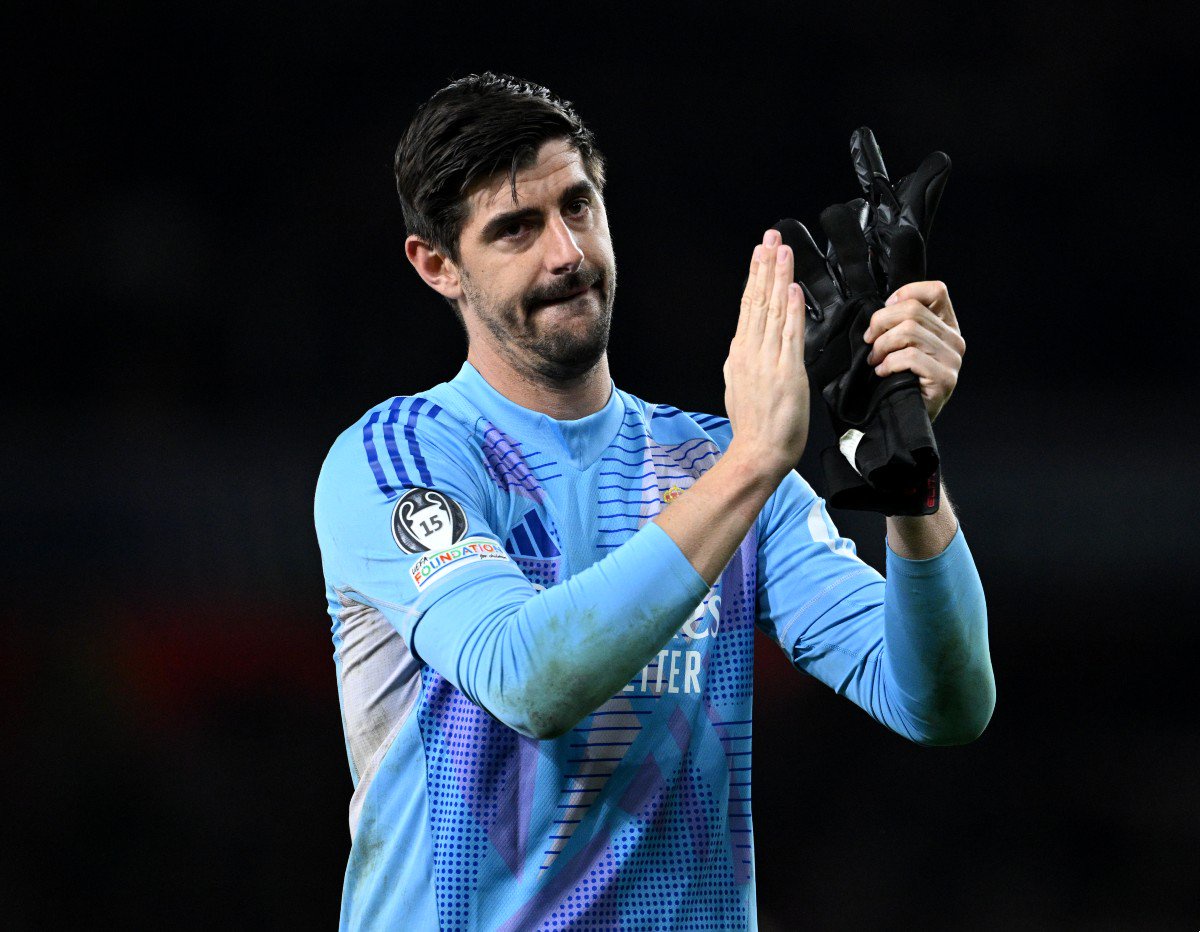 Thibaut Courtois applauds the Real Madrid fans following the 3-0 defeat to Arsenal at the Emirates Stadium