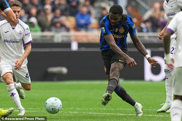 Inter Milan's Marcus Thuram scores his side's opening goal during the Serie A soccer match between Inter Milan and Fiorentina, in Milan, Italy, Sunday, Oct. 25, 2026. (AP Photo/Antonio Calanni)