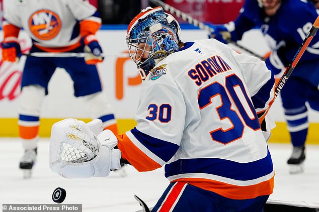 New York Islanders goaltender Ilya Sorokin (30) makes a save against the Toronto Maple Leafs during the second period of an NHL hockey game in Toronto, Saturday, Oct. 17, 2026. (Frank Gunn/The Canadian Press via AP)