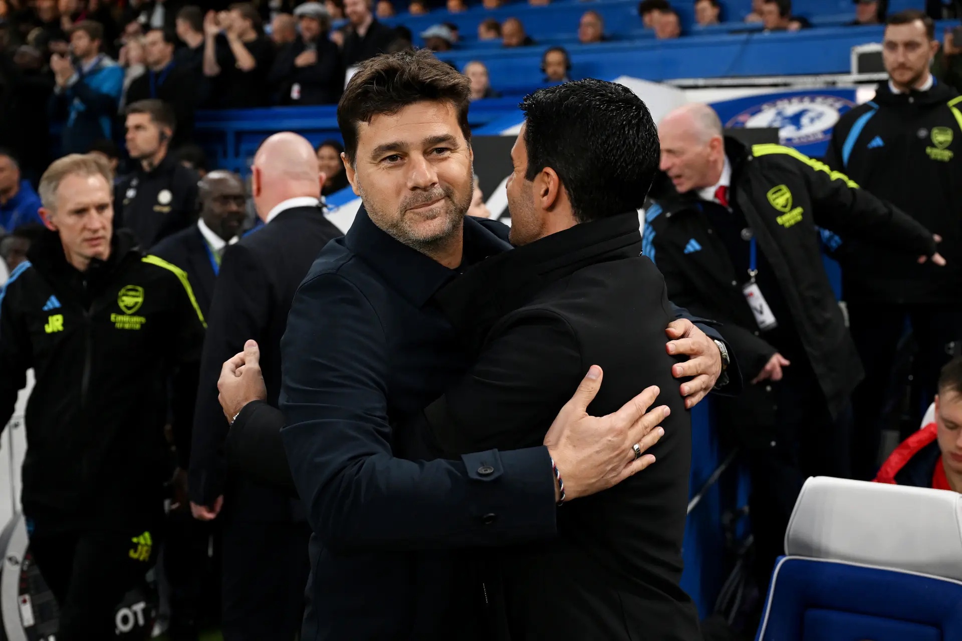 Mauricio Pochettino (left) hugging Arteta.