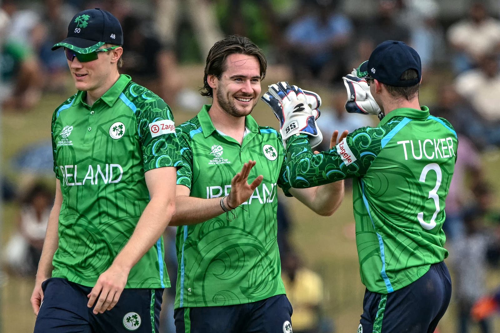 Ireland's Josh Little (C) celebrates with teammates after taking the wicket of Oman's Mohammad Nadeem. Photograph: Ishara S. KODIKARA/AFP via Getty Images
