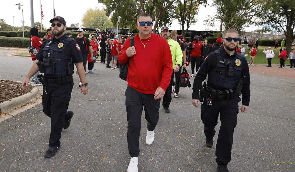 N.C. State interim head coach Todd Goebbel leads the Walk of Champions before N.C. State’s game against California at Cater-Finley Stadium in Raleigh, N.C., Saturday, Oct. 31, 2026.