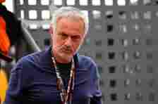 Former Chelsea and Tottenham Hotspur boss Jose Mourinho in a dark blue shirt with a lanyard around his neck.