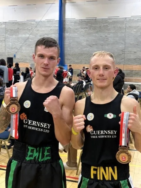 Emile Prevel, left, and Finn Walsh pose with their medals.