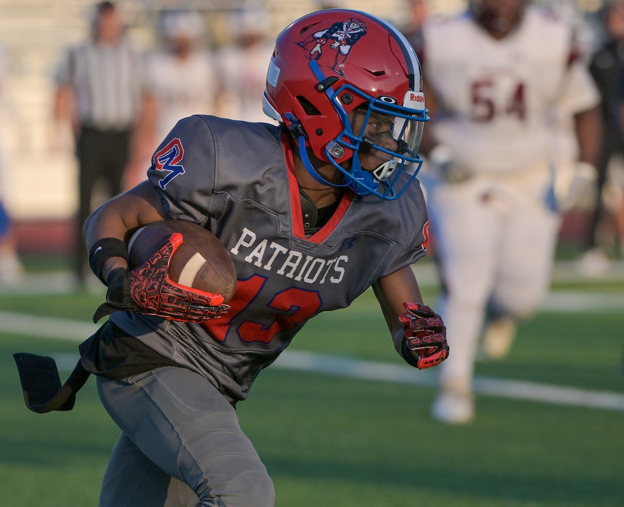 Old Mill Patriots Max Gregory #13 picks up yards after a catch in the second quarter. The Old Mill Patriots host the visiting Broadneck Bruins in high school football at the Severn Run High School. (Paul W. Gillespie/Staff)