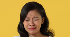 A Chinese woman crying [Shutterstock]