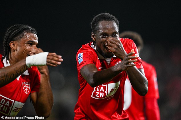 Eddy Kouadio of AC Monza celebrates scoring their side's first goal of the game during the Italian Serie A soccer match between AC Monza and Cagliari Calcio in Monza, Italy, Monday, Oct. 19, 2026. (Tiziano Ballabio/LaPresse via AP)