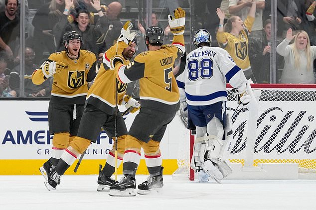 Vegas Golden Knights right wing Mark Stone, second from left, celebrates after scoring against the Tampa Bay Lightning during the first period of an NHL hockey game Tuesday, Oct. 20, 2026, in Las Vegas. (AP Photo/John Locher)