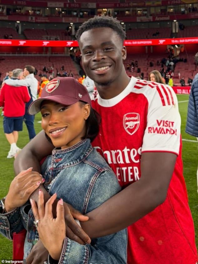 Branded 'The woman responsible for reviving WAG fever', Tolami Benson is pictured with her fiancée 'Star Boy' Bukayo Saka
