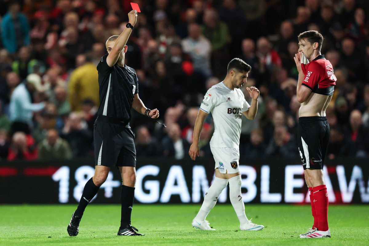 LINCOLN, ENGLAND - OCTOBER 14: Conor McGrandles of Lincoln City is shown a red card during the Sky Bet Championship 2026/27 match between Lincoln City and West Ham United at LNER Stadium on October 14, 2026 in Lincoln, England. (Photo by West Ham United FC/West Ham United FC via Getty Images)