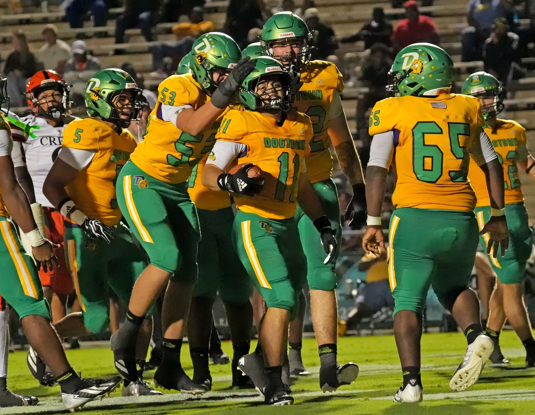 DeLand’s Cameron Gensler (11) scores a touchdown during the game against Spruce Creek on Sept. 25, 2026, at Spec Martin Stadium.