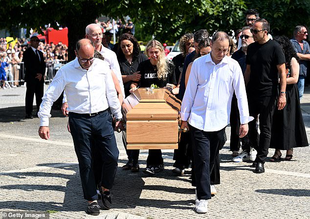 Maria Rodrigues, wife of Silva, was in floods of tears as she walked behind her husband's coffin along with pall bearers and family and friends