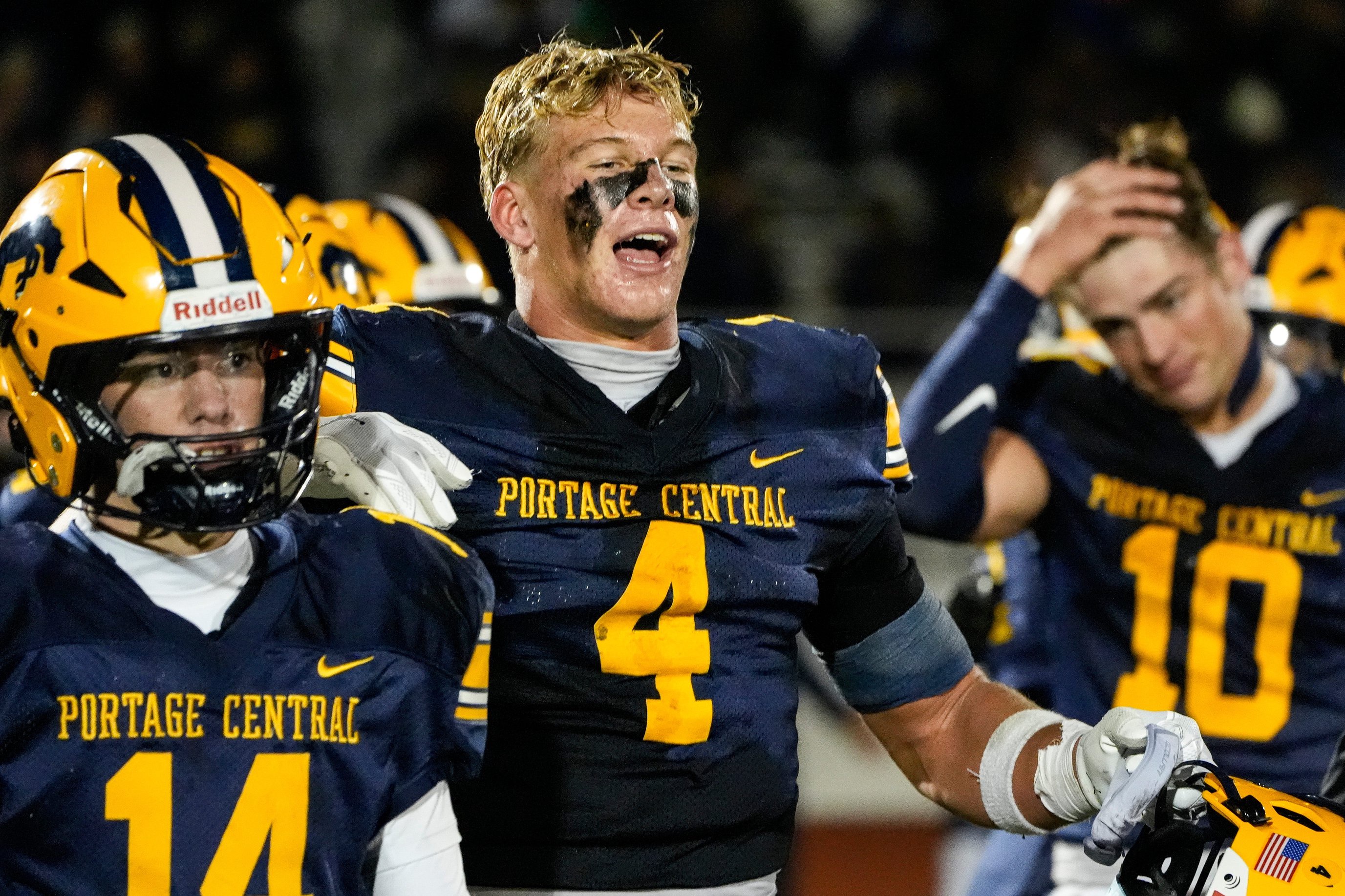 Portage Central’s Cam Noe celebrates 21-14 win over Hudsonville with teammates at Portage Central High School in Portage on Friday, Oct. 30, 2026.