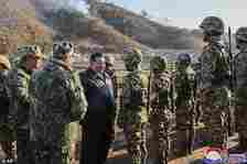 Kim Jong Un meets soldiers during a visit to a western operational training base in North Korea