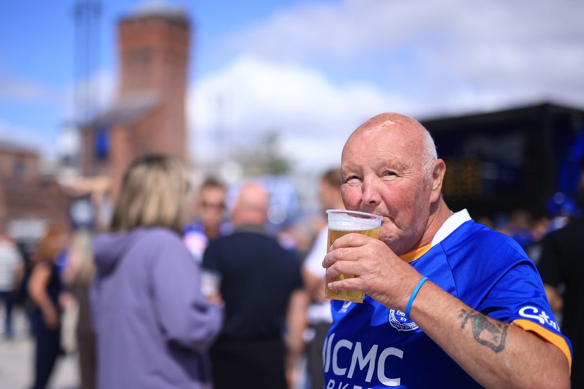 A fan drinks a beer before the match between Everton and Crystal Palace at Hill Dickinson Stadium on August 22, 2026