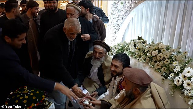 The wedding, held at the Uranus Wedding Palace in northern Kabul, was attended by 'thousands', but was entirely segregated