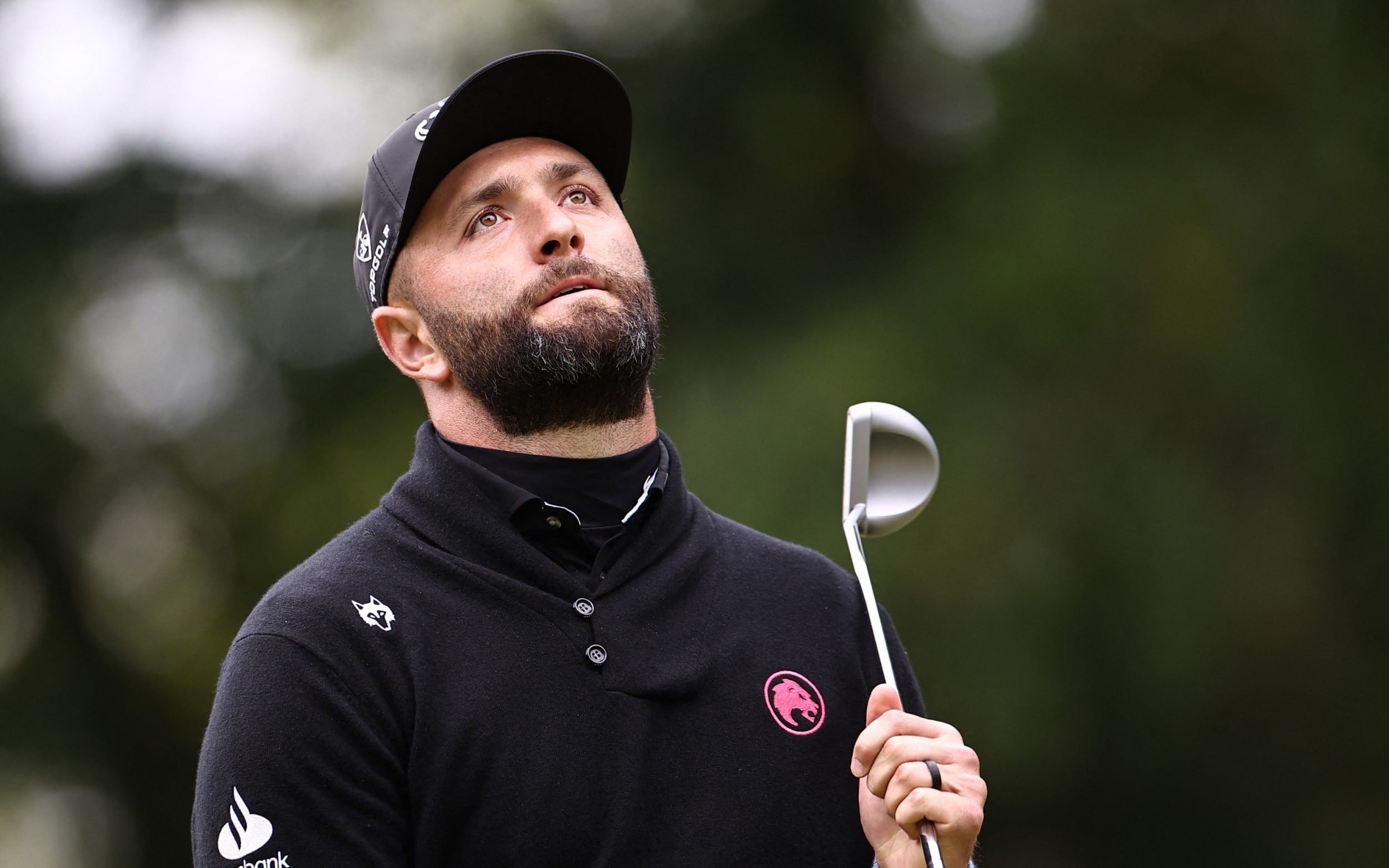 Jon Rahm reacts after missing a putt