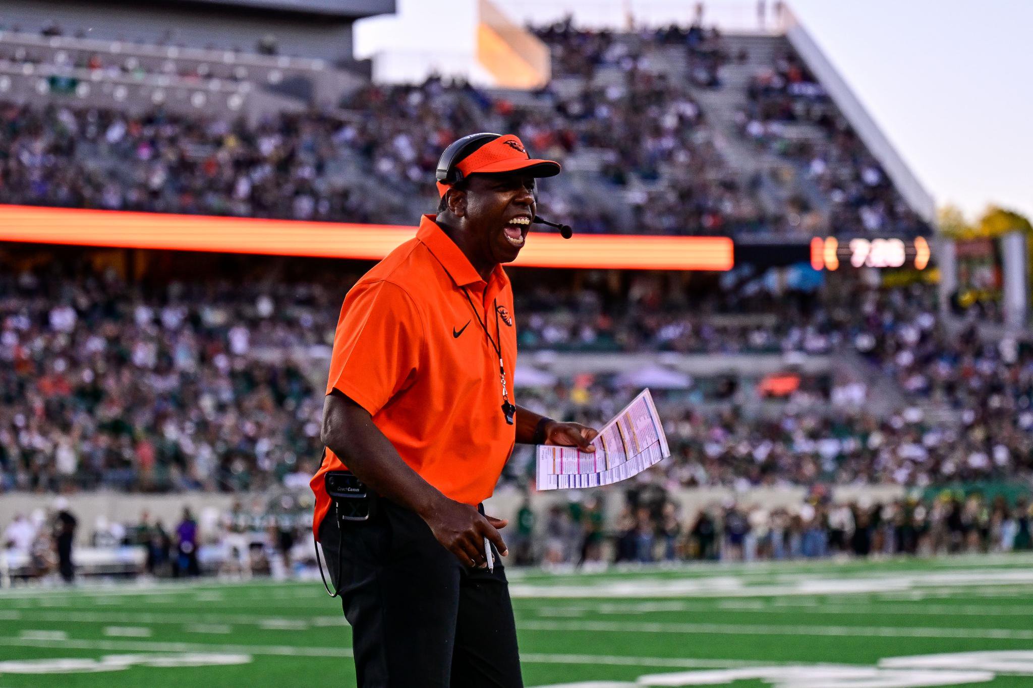 Oregon State Head Coach Jamarcus Shephard yells into his headset during a game against Colorado State.
