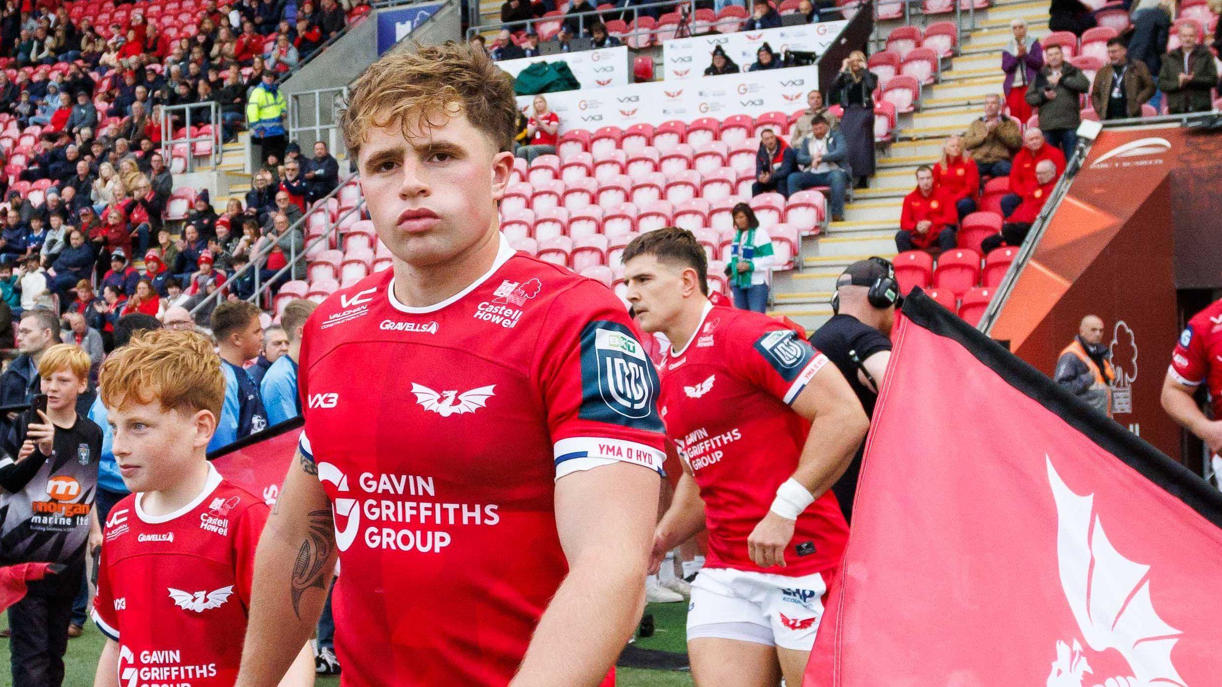 Macs Page pictured walking out for Scarlets at Parc y Scarlets