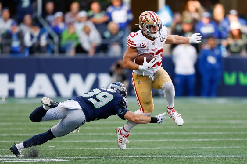 Christian McCaffrey runs the ball