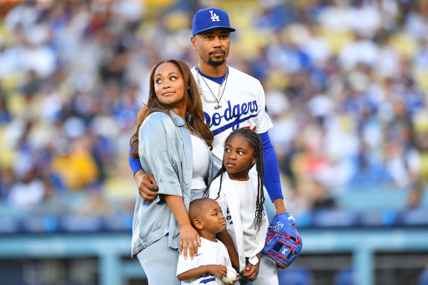Brianna and Mookie Betts stand with their children Kaj and Kynlee before a Los Angeles Dodgers home game in June. Brianna recently gave birth to another daughter, Khari.