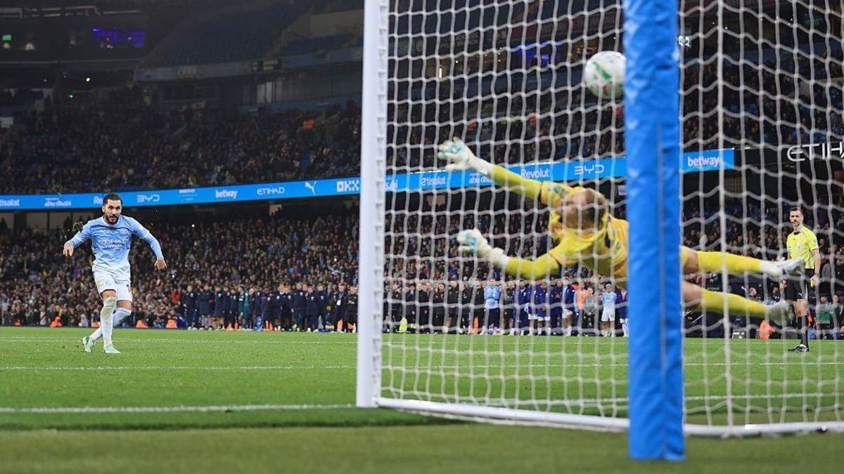 Rayan Cherki scoring a penalty against Brighton