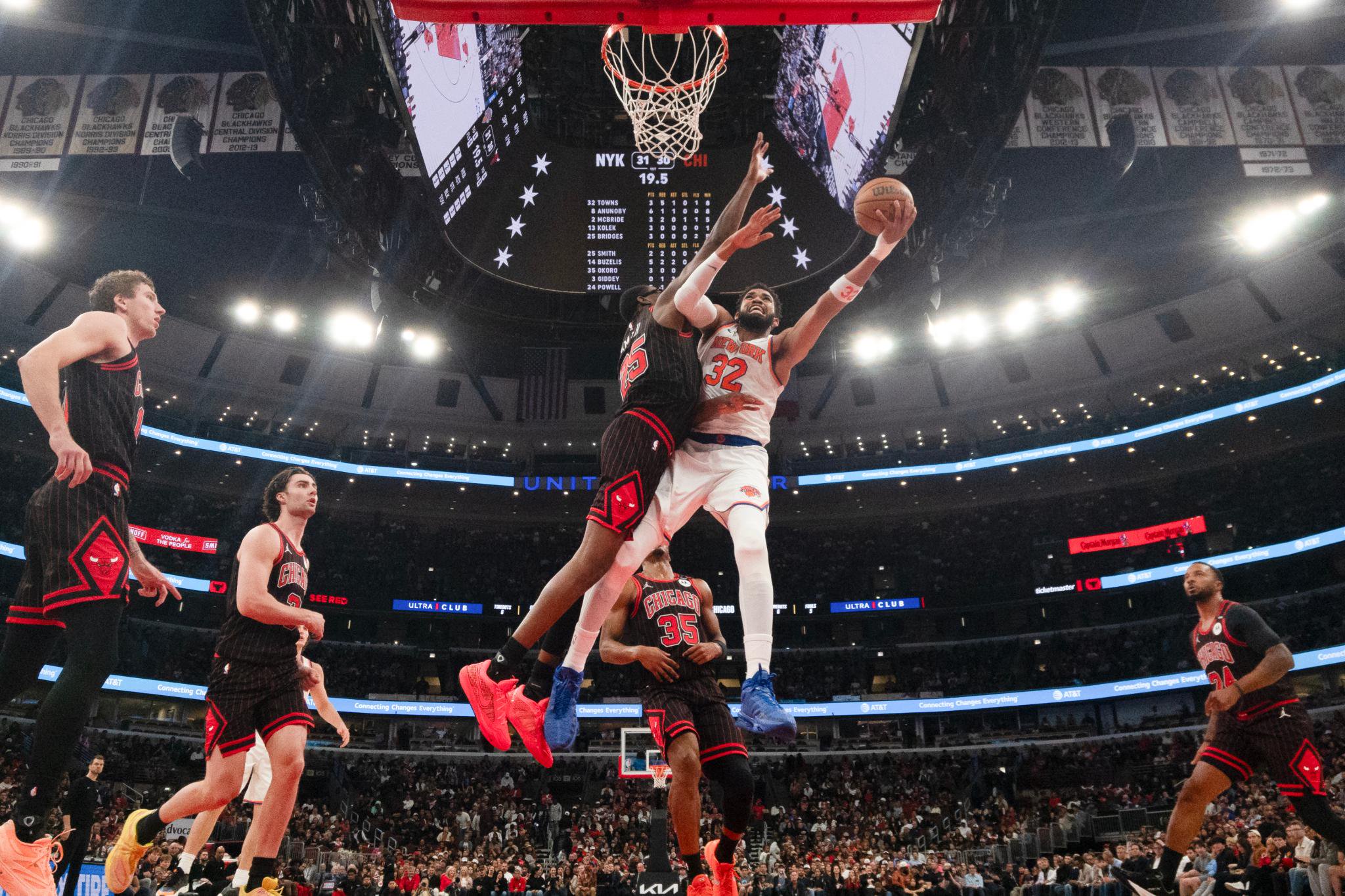 Chicago Bulls forward Jalen Smith defends New York Knicks center Karl-Anthony Towns during an NBA game.
